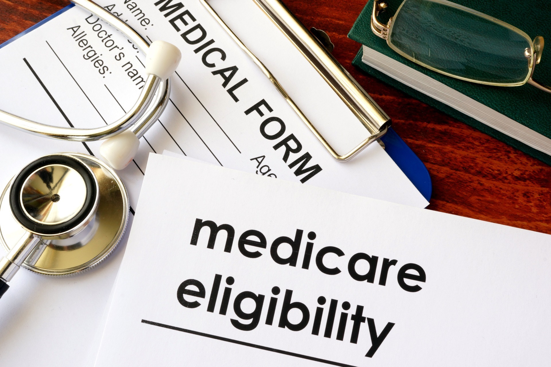 Medical form with stethoscope and text "medicare eligibility," representing healthcare coverage information.