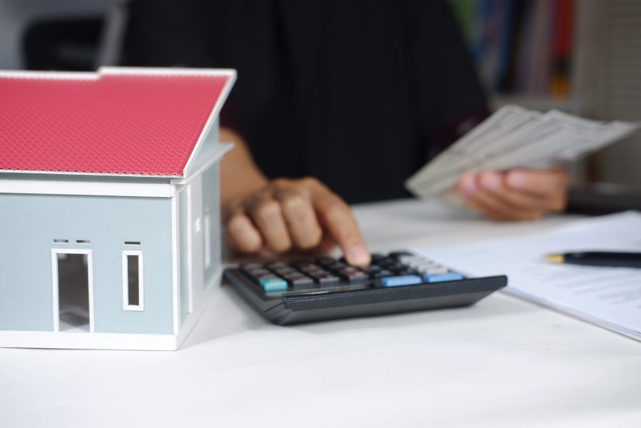 person calculating Workers' Compensation cost