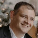 Timothy Baggett, CFP®, licensed insurance professional, smiling portrait, author at Amerus Financial, specializing in retirement planning and wealth management.