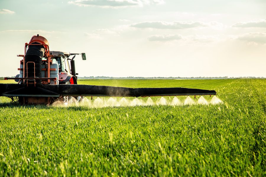farming tractor spraying pesticide 