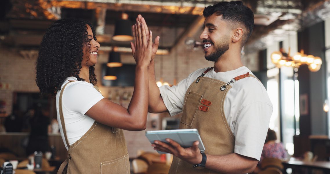 two people giving high fives