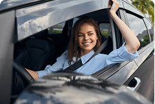 woman looking out the car window