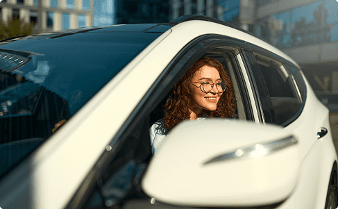 woman look out of car window