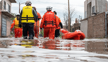 workers on a flooded street