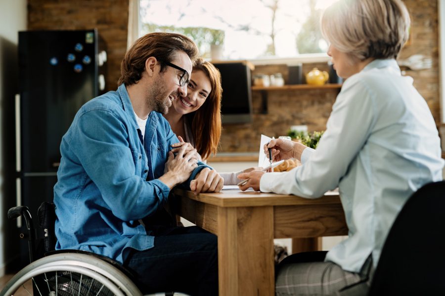 Disability person talking to an insurance agent