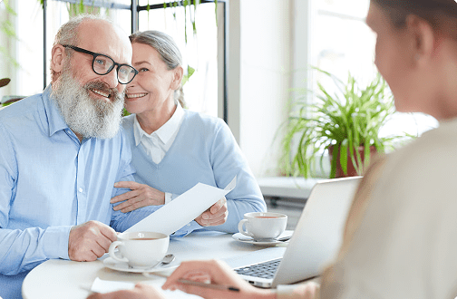 senior couple talking to life insurance agent