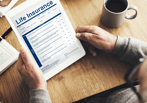 senior reviewing life insurance policy