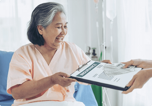 senior woman paying for insurance